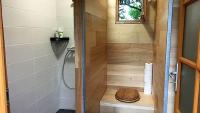 a small bathroom with a shower with a toilet at Maison d hôtes Casa Sana in Pillac