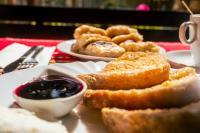 a plate of food with bread and dipping sauce on a table at Safari Village Velingrad in Velingrad