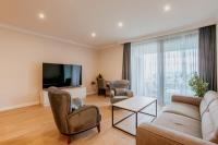 Televízia a/alebo spoločenská miestnosť v ubytovaní Carmen Residence Apartments