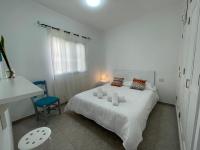 Postel nebo postele na pokoji v ubytování Cangrejo House in Famara, Super Wifi