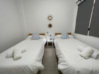 Postel nebo postele na pokoji v ubytování Cangrejo House in Famara, Super Wifi