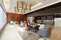 two women sitting in chairs in a lobby at Guanko Hotel in Chiayi City