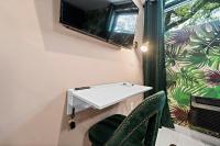 Wanderstay Boutique Hotelにあるテレビまたはエンターテインメントセンター