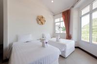 Postel nebo postele na pokoji v ubytování Twin Villas Ao Nang