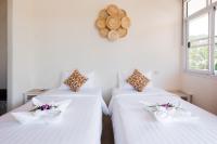 Postel nebo postele na pokoji v ubytování Twin Villas Ao Nang