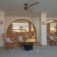 a room with wicker chairs and a ceiling fan at Hotel & Spa Blau Parc in San Antonio