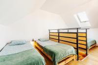 Posteľ alebo postele v izbe v ubytovaní Loft House Rozewie - Całoroczne domki z Balią ogrodową