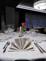 a table with glasses and a napkin on top of it at Hotel Sonne Sissach in Sissach