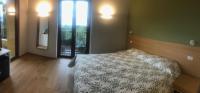 Postel nebo postele na pokoji v ubytování Agriturismo Forest B&B