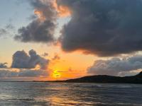 a sunset over the ocean with clouds in the sky at Yeux D&#39;azur in Le Souffleur