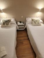 Postel nebo postele na pokoji v ubytování Hostal CASA FRAN