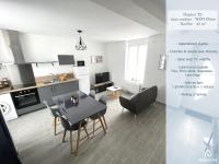a kitchen and living room with a table and chairs at 180A - Duplex T2 Tout Confort du Gond - 45 m2 in Le Gond-Pontouvre