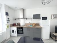 a kitchen with a sink and a dishwasher at 180A - Duplex T2 Tout Confort du Gond - 45 m2 in Le Gond-Pontouvre