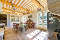 a kitchen and dining room with a table and chairs at Villa de 6 chambres avec piscine privee jardin clos et wifi a Saignon in Saignon