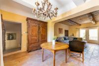 a living room with a table and a couch at Villa de 6 chambres avec piscine privee jardin clos et wifi a Saignon in Saignon