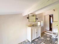 a bathroom with a sink and a toilet at Villa de 6 chambres avec piscine privee jardin clos et wifi a Saignon in Saignon