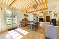 a kitchen and dining room with a table and chairs at Villa de 6 chambres avec piscine privee jardin clos et wifi a Saignon in Saignon