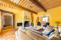 a living room with a couch and a fireplace at Villa de 6 chambres avec piscine privee jardin clos et wifi a Saignon in Saignon