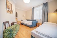 A bed or beds in a room at Das Grüne Hotel zur Post - 100 % BIO