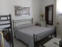 A bed or beds in a room at B&B Lo Scrigno del Salento