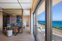 a dining room with a view of the ocean at Four Seasons Hotel in Limassol