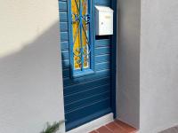 a blue door with a window on a house at Studio Collioure, 2 pièces, 4 personnes - FR-1-309-153 in Collioure