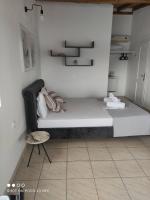 Posteľ alebo postele v izbe v ubytovaní Vetti Rooms