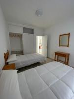 Postel nebo postele na pokoji v ubytování Las Piteras Bungalows