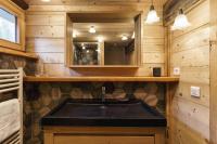 a bathroom with a black sink and a mirror at Chalet Mollard - Happy Rentals in Vallorcine