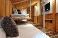 a room with two beds and a hanging bed at Chalet Mollard - Happy Rentals in Vallorcine