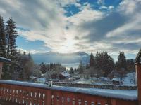 a view from a balcony of a snow covered mountain at Sweet Cherry - Boutique &amp; Guesthouse Tyrol in Innsbruck