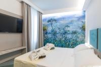 Posteľ alebo postele v izbe v ubytovaní Hotel L'Approdo