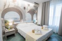 Posteľ alebo postele v izbe v ubytovaní Hotel L'Approdo