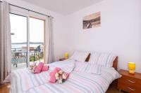 Postel nebo postele na pokoji v ubytování Lulak Studio Apartments