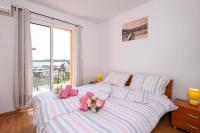 Postel nebo postele na pokoji v ubytování Lulak Studio Apartments