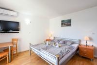 Postel nebo postele na pokoji v ubytování Lulak Studio Apartments