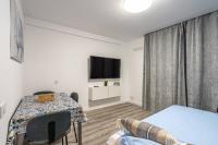 TV a/nebo společenská místnost v ubytování Los Cristianos - San Telmo piscina y vistas mar 1
