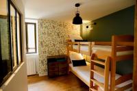 two bunk beds in a room with a green wall at Gîte d&#39;AURE. Classé en meublé 4 étoiles. 