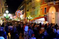 a crowd of people walking down a street at night at Studio Climatisé dans villa bourgeoise in Nice