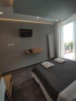 A bed or beds in a room at Hotel Due Gemelli