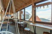 a room with a hammock in a cabin with windows at Backcountry in Kopaonik