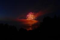a firework display in the sky over a body of water at Kerbugalic Grand gîte, Magnifique vue mer in Trévou-Tréguignec