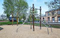 an empty playground with a slide in a park at Lovely Apartment In Houlgate With Wifi in Houlgate