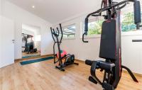 a gym with treadmills and exercise equipment in a house at Stunning Home In Siveric With 5 Bedrooms, Jacuzzi And Outdoor Swimming Pool in Siverić