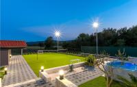a backyard with a tennis court and a soccer field at Stunning Home In Siveric With 5 Bedrooms, Jacuzzi And Outdoor Swimming Pool in Siverić