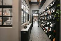 una camera con una mensola di bottiglie di vino di Almayer Art & Heritage Adults Only Hotel and Dépendance rooms a Zara (Zadar)