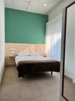 Postel nebo postele na pokoji v ubytování Villas Vairocana