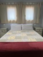 Postel nebo postele na pokoji v ubytování Villas Vairocana