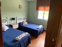 Postel nebo postele na pokoji v ubytování Migueliño - Casa Tía María