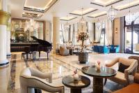 a lobby with a piano and a grand piano at Jumeirah Mina Al Salam Dubai in Dubai